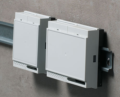 Low profile DIN rail enclosures